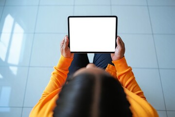 Person Holding Tablet Device Looking Downward, Top View