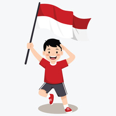 A cheerful young boy runs while holding and waving the Indonesian flag with pride and joy.