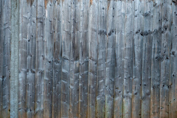 Vertical Natural Wood Panels with Rustic Texture and Knots
