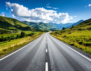 Naklejka premium Asphalt road winds through lush valley, towards a backdrop of towering mountains under a vibrant blue sky