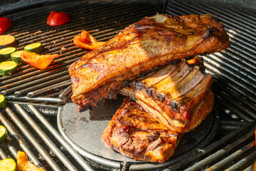 Grilled Pork Ribs And Vegetables On Barbecue. Summer Barbecue Scene With Juicy Pork Ribs And Colorful Grilled Vegetables Outdoor Cooking And Picnic Atmosphere.