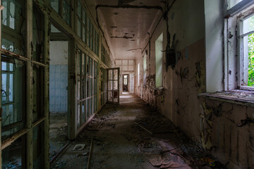 Dark creepy corridor of abandoned hospital. Horror concept