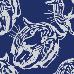 Seamless, Hand drawn brush line dynamic and stylized roaring tiger faces in distressed white on indigo blue pattern. Japanese and ethnic wood caving, block print vintage animal print background. Simpl