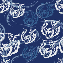 Hand drawn vibrant seamless pattern with stylized roaring tiger heads with flowing brushstroke effects and blue background. Dynamic and modern, perfect for apparel, packaging, and digital media.
