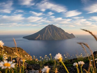 A photograph of a pristine mountain peak piercing a vibrant blue sky in the sea.