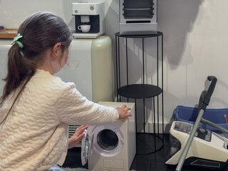 Girl Learning Chores Playing with Toy Appliances