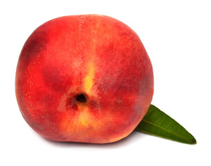 One peach with leaf isolated on white background