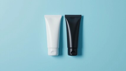 Two cosmetic cream tubes black and white on a blue background, perfect for beauty products visual. 