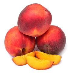 Pile of peaches with slices isolated on white background