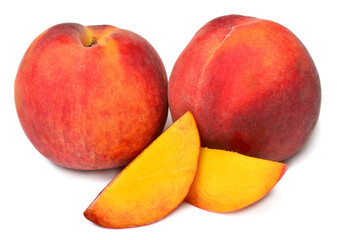 Pile of peaches with slices isolated on white background