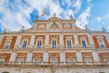 Low angle view of the Royal Palace of Aranjuez with its grand architecture.