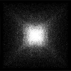 Obraz premium Abstract monochrome image with a bright central area surrounded by dense dark speckles and noise texture