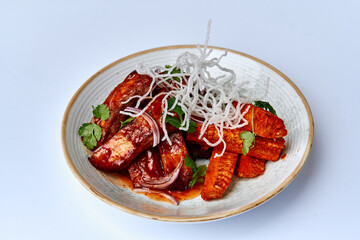 Deliciously Spiced Roasted Root Vegetables Garnished with Fresh Herbs and Crispy Onions for a Flavorful Culinary Experience