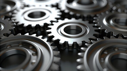 Obraz premium Close up of interlocking metal gears and machinery parts