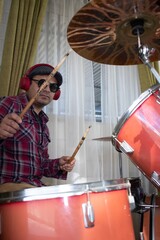 latino musician plays the drums