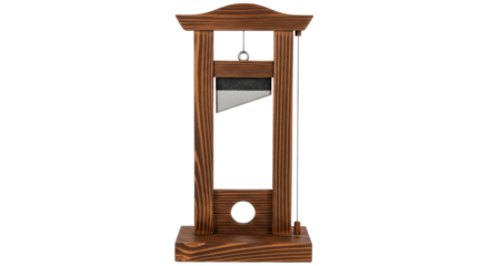 Miniature wooden guillotine model isolated on a white background for history and punishment concepts.