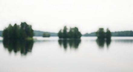 Obraz premium Serene Lake Scene with Islands Completely Blurry Landscape in Soft, Dreamlike Blur