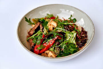 Colorful and Flavorful Salads with Fresh Vegetables, Grilled Meats, and Herby Garnishes Served in a Rustic Bowl