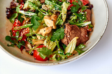 A Vibrant Salad Bowl Featuring Fresh Vegetables, Tender Meat, and Aromatic Herbs for a Healthy and Delicious Meal Experience