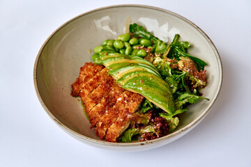 Succulent Crispy Fish Fillet Served with Fresh Salad and Avocado Slices for a Healthy and Flavorful Meal Experience