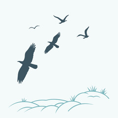 Silhouette of birds flying over rolling hills and grass