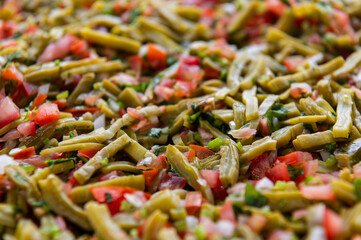 Fresh chopped Nopales Salad with tomatoes and onions 