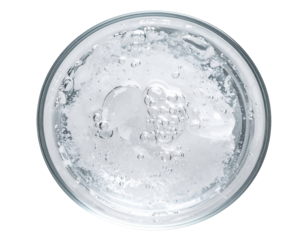Clear face gel with air bubbles in round glass container, top view on isolated background