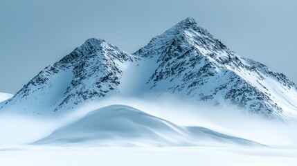 Obraz premium Snowy mountain peaks in a misty landscape