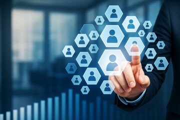 Businessman touching virtual hexagonal icons representing people on a digital interface with light effects over a modern office background.