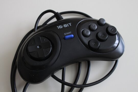Sega Megadrive 16 bit gamepad on white background