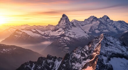 Snowy mountain peaks at sunrise dramatic alpine landscape