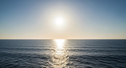 Obraz premium Serene Ocean Horizon Bathed in Golden Sunlight Creating a Tranquil Seascape