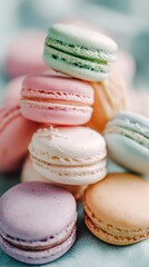Obraz premium Colorful macarons stacked on a textured surface