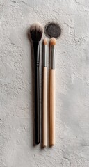 Makeup brushes on a textured surface