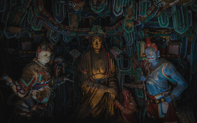 Obraz premium Brass painted Buddha Statue in ancient temple in Shanxi China