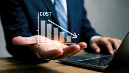 Businessman presenting cost reduction graph with laptop, showing financial success and savings