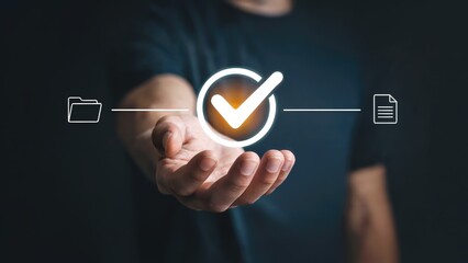 Hand holding illuminated checkmark symbolizing approval, success, and data verification concept