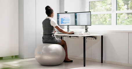 Corporate African American Woman Working On Exercise Ball