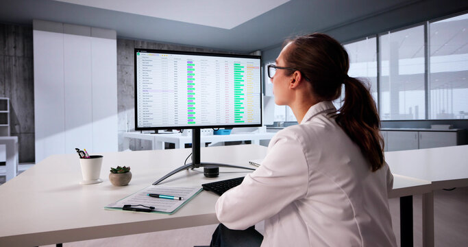 Female Healthcare Analyst Utilizing Technology