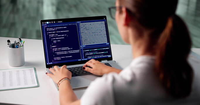 Skilled Software Developer Typing On Laptop