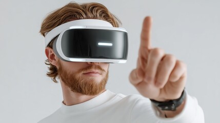 Young Man Using Virtual Reality Headset Interacting Digitally Against White Background