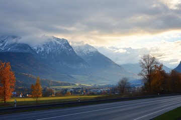 Naklejka premium Driving through the breathtaking Austrian countryside during sunset along the freeway, Driving around the freeway during sunset in Austria on a late afternoon in autumn