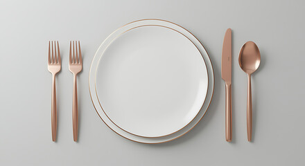 Elegant rose gold cutlery and white plate set for dining