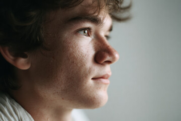 Fototapeta premium young man with trembling chin stands at intersection of dreams and reality