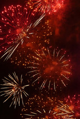 Vertical Horizon Red Firework celebrate anniversary night time celebrate national holiday. Happy new year 2025 4th of july holiday festival. Vertical Red firework Countdown to new year 2025