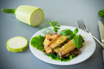 Vegetable appetizer of zucchini and dill on a gray background