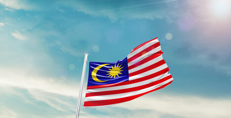 Malaysia national flag waving with beautiful sky.