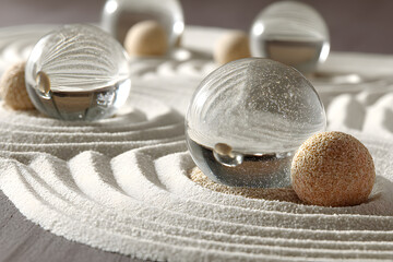Tranquil Scene of Glass Spheres and Rippled Sand Patterns