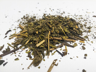 Close up. Pile of dried tea leaves isolated on white background.