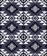 Fototapeta premium seamless geometric pattern, A seamless tribal-inspired geometric pattern with diamond and triangle shapes in black and white tones, perfect for textiles, wallpapers,